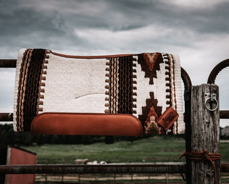 Traditional Western-style saddle pad designed to enhance comfort and support for leather horse saddles.